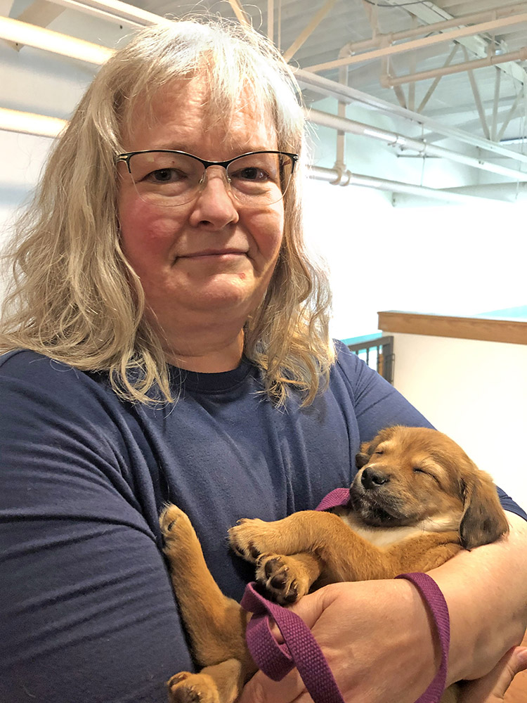 Jen Garrison holding a puppy